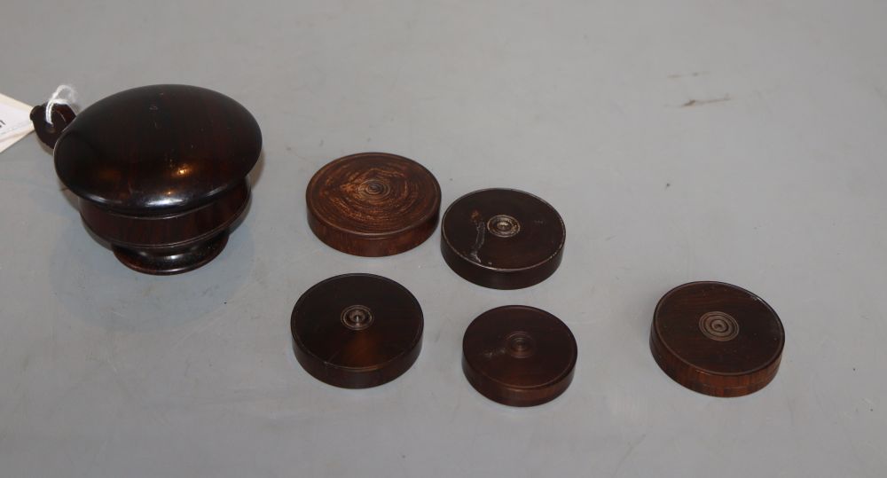 A 19th century rosewood nutmeg grater and five rosewood boxes containing wax seals
